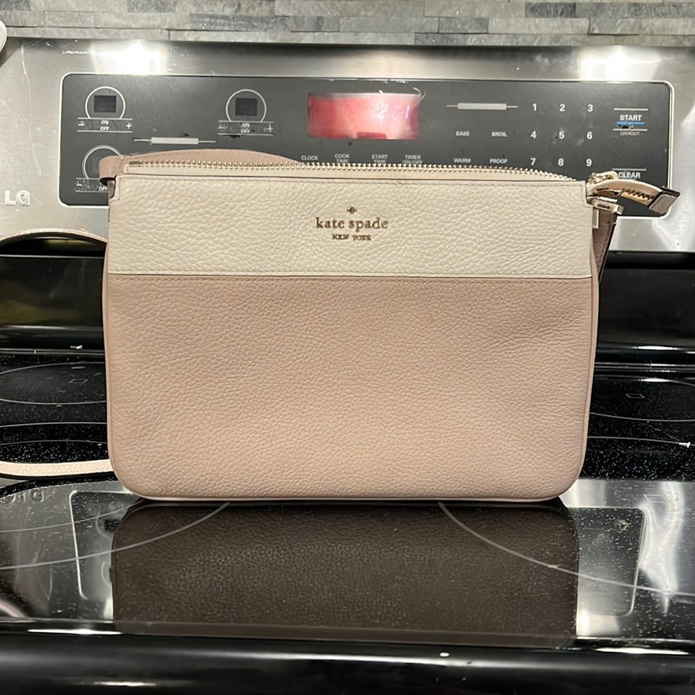 Tan and white Kate Spade crossbody bag